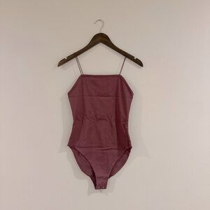 Spaghetti strap body suit in like new condition.